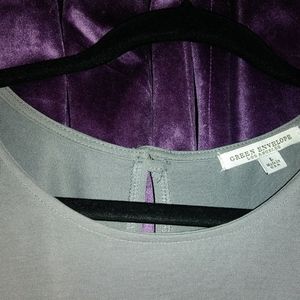 Green envelope-grey blouse